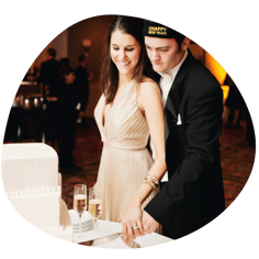 A picture of Nick Chapleau and his wife cutting a cake