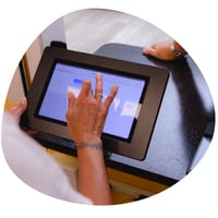 A picture of a tablet sitting on a counter with the Cents dashboard on display