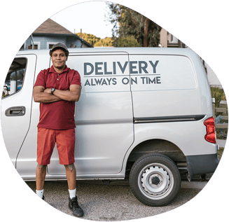 Man standing in front of a Laundry Delivery Truck