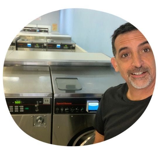 An image of Brad Guerra in front of a laundry machine with the Penny on the front
