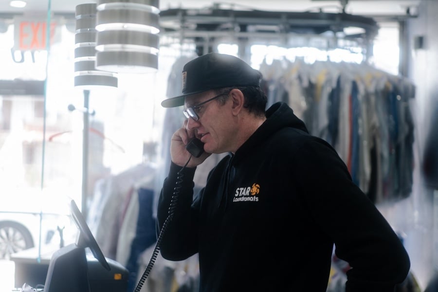 jason-on-phone-at-star-laundromats-close